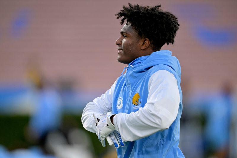 Nov 8, 2024; Pasadena, California, USA; UCLA Bruins quarterback Karson Gordon (19) warms up prior to the game against the Iowa Hawkeyes at the Rose Bowl. Mandatory Credit: Jayne Kamin-Oncea-Imagn Images