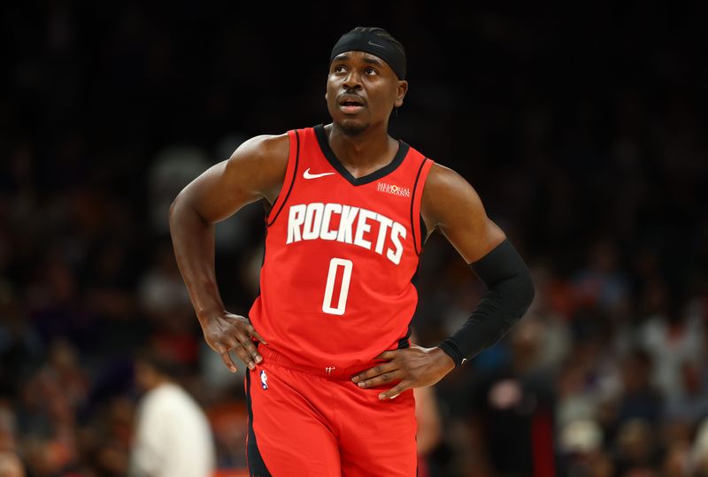 Apr 7, 2026; Phoenix, Arizona, USA; Houston Rockets guard Aaron Holiday (0) against the Phoenix Suns at Mortgage Matchup Center. Mandatory Credit: Mark J. Rebilas-Imagn Images