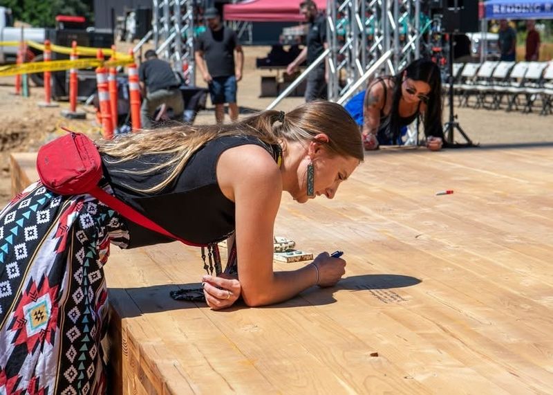 Members of the Redding Rancheria write messages as part of the "Last Beam" ceremony for the Tribal Health Village being built in south Redding.