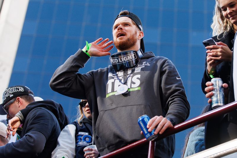 Feb 11, 2026; Seattle, WA, USA; Seattle Seahawks quarterback Sam Darnold (14) reacts during the Super Bowl LX parade. Mandatory Credit: Kevin Ng-Imagn Images