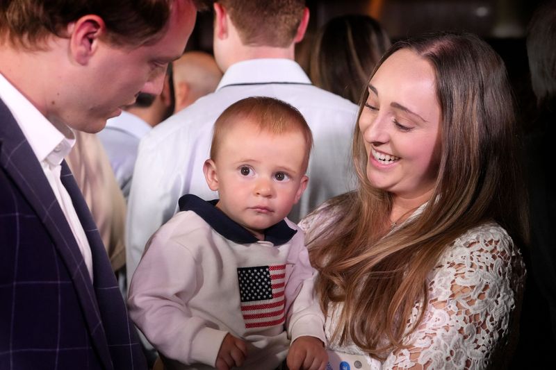 Moorpark residents Jackson Grasz, his wife Kayla, and their 18-month-old son William attend a May 28 event in Westlake Village, which promoted the Trump administration's tax-free investment account for kids.