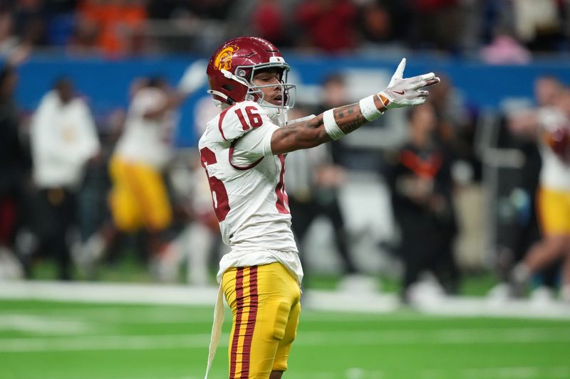 Dec 30, 2025; San Antonio, TX, USA; Southern California Trojans wide receiver Tanook Hines (16) gestures after a reception against the TCU Horned Frogs in the second half during the Alamo Bowl at Alamodome. Mandatory Credit: Kirby Lee-Imagn Images