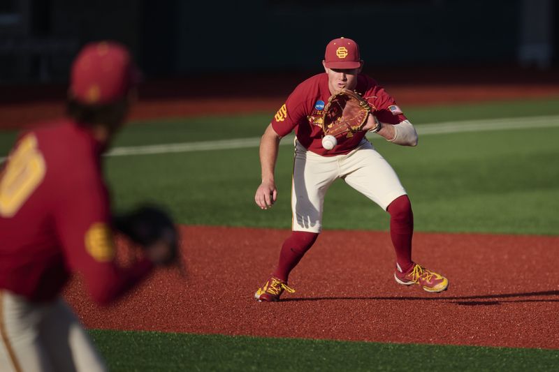 May 31, 2025; Corvallis, OR, USA; USC infielder Ethan Hedges (15) fields a ground ball for an out during the fifth inning against Saint Mary's at the NCAA Corvallis Regional at Goss Stadium. Mandatory Credit: Troy Wayrynen-Imagn Images