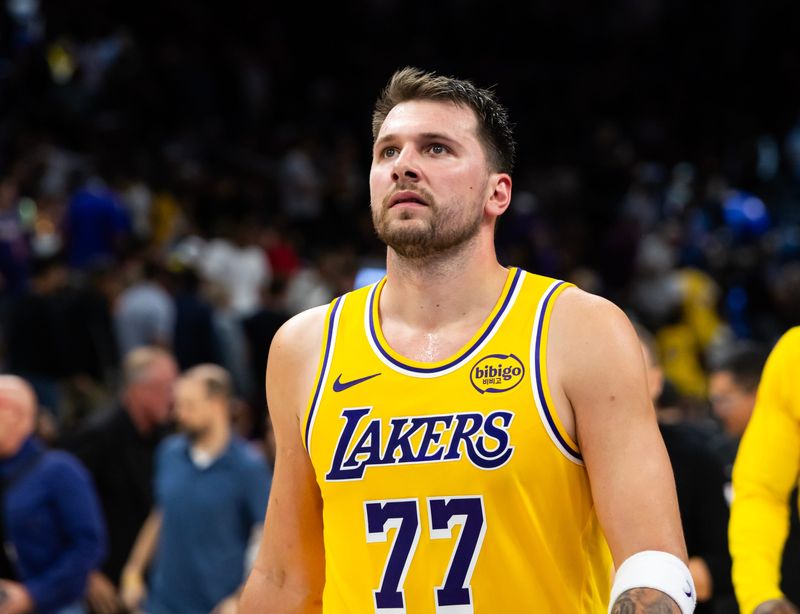 Feb 26, 2026; Phoenix, Arizona, USA; Los Angeles Lakers guard Luka Doncic (77) against the Phoenix Suns at Mortgage Matchup Center. Mandatory Credit: Mark J. Rebilas-Imagn Images