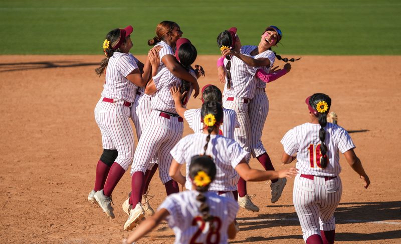 Oxnard High softball players celebrate after defeating Mission Viejo 3-1 in the CIF-Southern Section Division 4 softball final on Saturday, May 30, 2026, at Deanna Manning Stadium in Irvine.