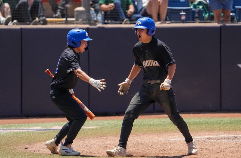 Agoura outfielder Jonathan Thevenot (right) celebrates with a teammate after scoring the first run in a 9-7 loss to Mira Costa in the CIF-Southern Section Division 3 baseball final on Saturday, May 30, 2026, at Cal State Fullerton.