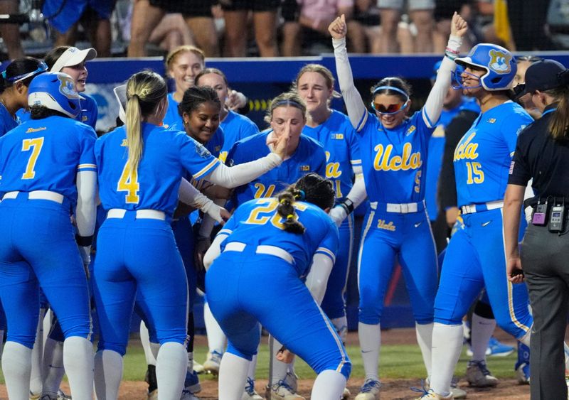 UCLA's Jordan Woolery (15) celebrates a home run in the seventh inning of a Women's College World Series softball game between Texas Tech Red Raiders and the UCLA Bruins at Devon Park in Oklahoma City, May 31, 2026.