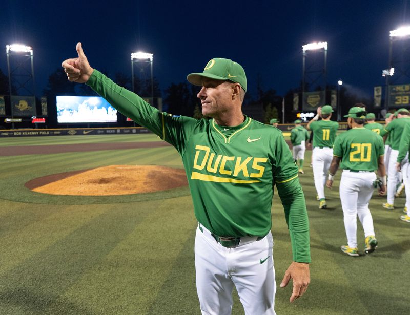 Oregon head baseball coach Mark Wasikowski gives a thumbs up to the stands after the Ducks defeated Oregon State on day three at the NCAA Eugene Regional Tournament at PK Park in Eugene May 31, 2026.