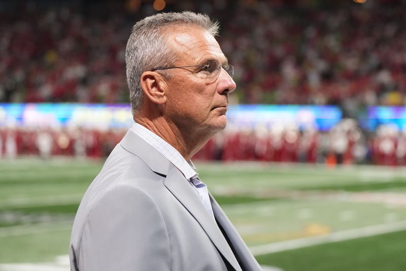 Jan 9, 2026; Atlanta, GA, USA; Urban Meyer on the sidelines prior to the 2025 Peach Bowl and semifinal game of the College Football Playoff between the Oregon Ducks and the Indiana Hoosiers at Mercedes-Benz Stadium. Mandatory Credit: Dale Zanine-Imagn Images