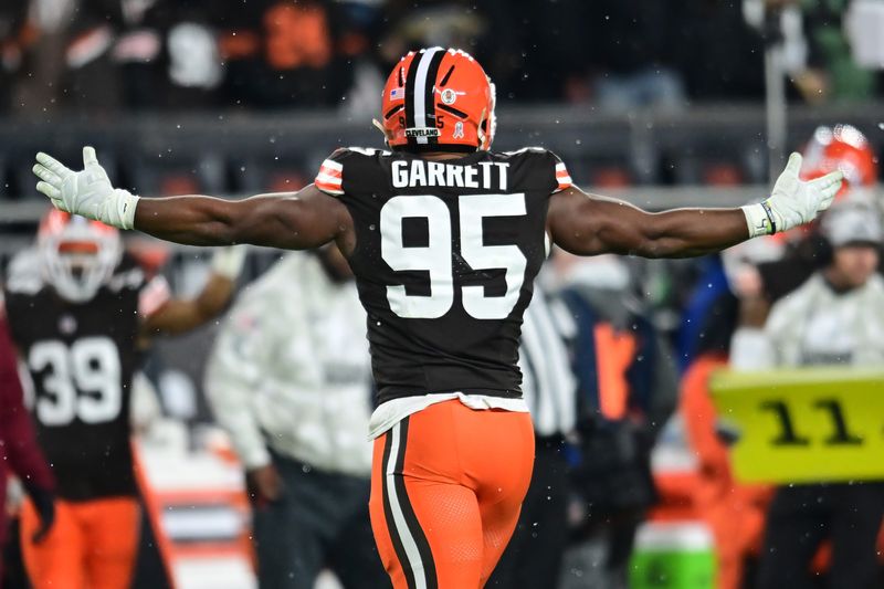 Nov 21, 2024; Cleveland, Ohio, USA; Cleveland Browns defensive end Myles Garrett (95) celebrates after sacking Pittsburgh Steelers quarterback Russell Wilson (not pictured) during the first half at Huntington Bank Field. Mandatory Credit: Ken Blaze-Imagn Images