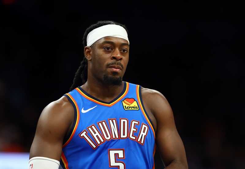 Apr 27, 2026; Phoenix, Arizona, USA; Oklahoma City Thunder guard Luguentz Dort (5) against the Phoenix Suns during game four of the first round of the 2026 NBA Playoffs at Mortgage Matchup Center. Mandatory Credit: Mark J. Rebilas-Imagn Images