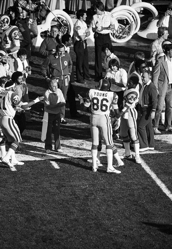 Jan 20, 1980; Pasadena, CA, USA; FILE PHOTO; Los Angeles Rams tight end Charle Young (86) on the sideline with linebacker Joe Harris (51) and running back Eddie Hill (24) during Super Bowl XIV against the Pittsburgh Steelers at the Rose Bowl. The Steelers defeated the Rams 31-19. Mandatory Credit: Manny Rubio-USA TODAY Sports