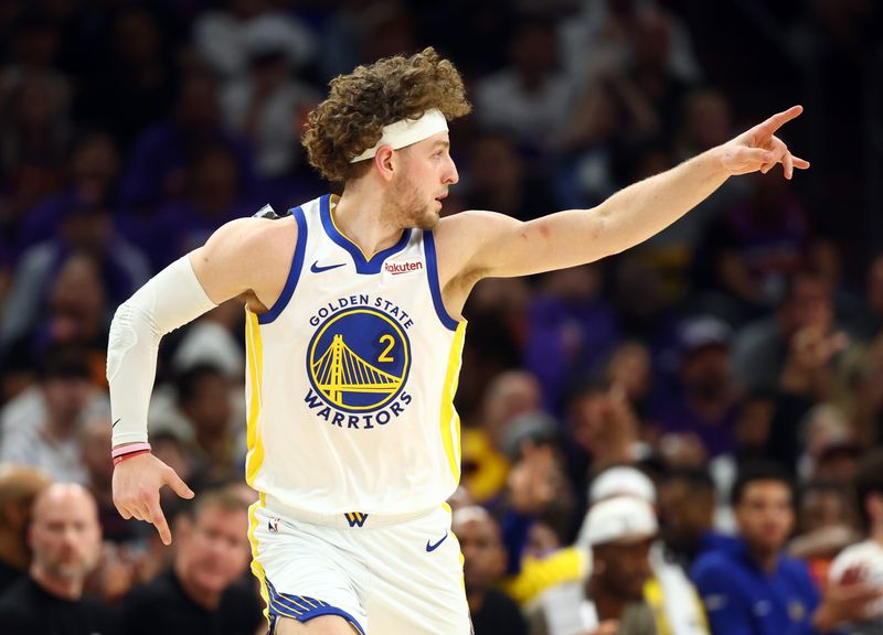 Apr 17, 2026; Phoenix, Arizona, USA; Golden State Warriors guard Brandin Podziemski (2) reacts against the Phoenix Suns during the first half in the play-in rounds of the 2026 NBA Playoffs at Mortgage Matchup Center. Mandatory Credit: Mark J. Rebilas-Imagn Images