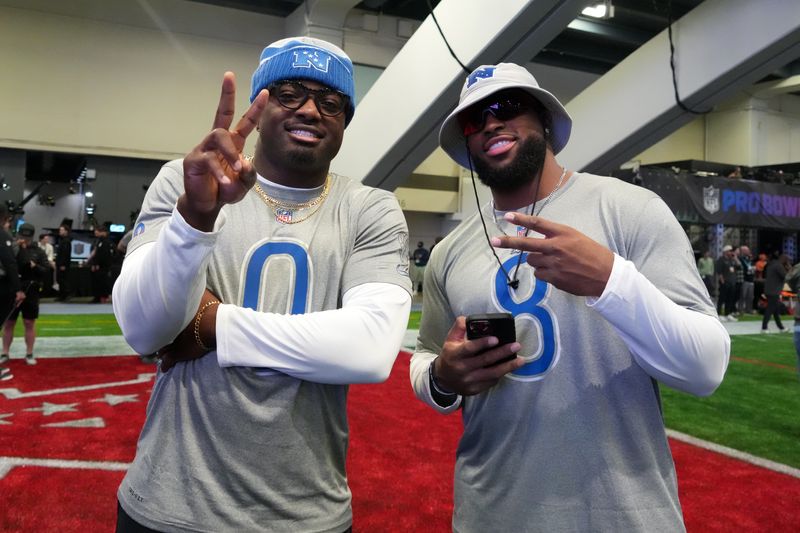 Feb 2, 2026; San Francisco, CA, USA; Los Angeles Rams linebackers Byron Young (0) and Jared Verse (8) pose during NFC practice at the NFL Flag Fieldhouse at Moscone Center South Building. Mandatory Credit: Kirby Lee-Imagn Images
