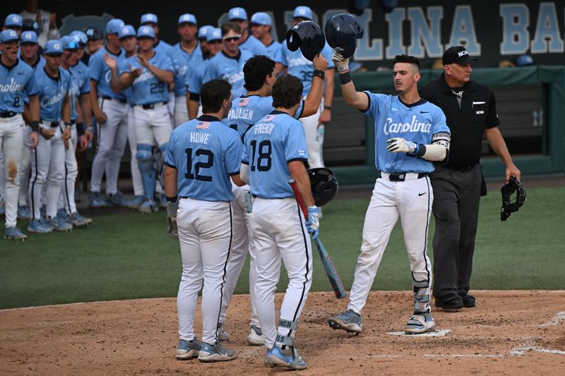 May 30, 2026; Chapel Hill, NC, USA; North Carolina Tar Heels catcher Colin Hynek (23) is greeted at the plate after a home run during game 4 of the Chapel Hill Regional at Boshamer Stadium. Mandatory Credit: William Howard-Imagn Images