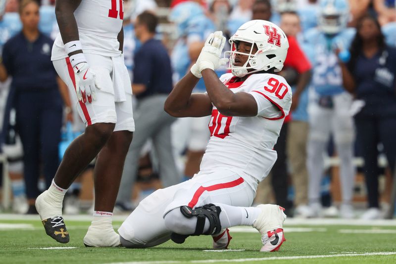Sep 6, 2025; Houston, Texas, USA; Houston Cougars defensive lineman Eddie Walls III (90) reacts after making a tackle during the first quarter against the Rice Owls at Rice Stadium. Mandatory Credit: Troy Taormina-Imagn Images