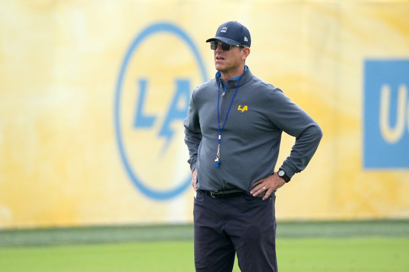 May 11, 2026; El Segundo, CA, USA; Los Angeles Chargers coach Jim Harbaugh watches during offseason workouts at The Bolt. Mandatory Credit: Kirby Lee-Imagn Images