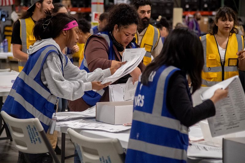 Election workers prepare ballots for counting machines at San Joaquin County Registrar of Voters facility at the Stockton Metropolitan Airport Stockton on Jun. 2, 2026.