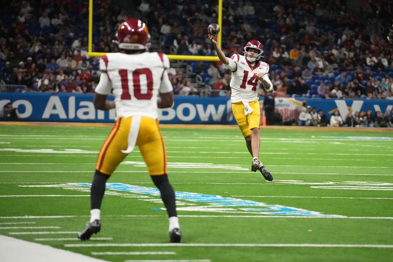 Dec 30, 2025; San Antonio, TX, USA; Southern California Trojans quarterback Jayden Maiava (14) throws the ball to wide receiver Corey Simms (10) against the Southern California Trojans in the second half during the Alamo Bowl at Alamodome. Mandatory Credit: Kirby Lee-Imagn Images