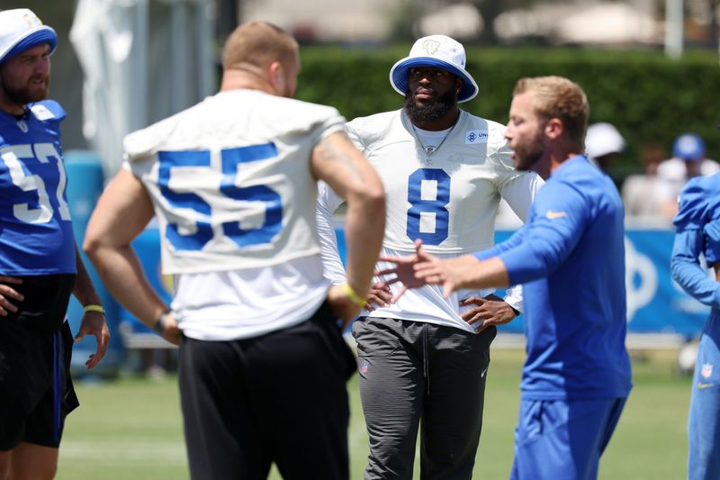 Jul 31, 2024; Los Angeles, CA, USA; Los Angeles Rams defensive end Jared Verse (8) and defensive tackle Braden Fiske (55) listen to head coach Sean McVay during training camp at Loyola Marymount University. Mandatory Credit: Kiyoshi Mio-USA TODAY Sports