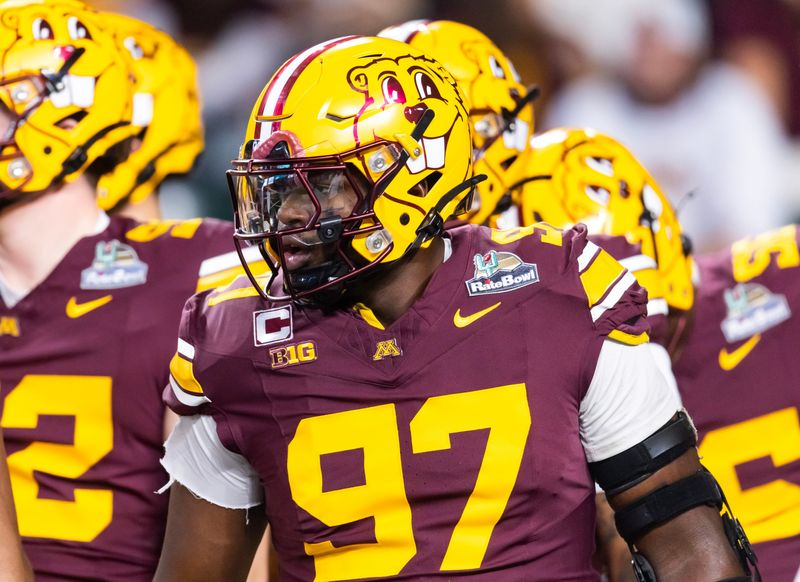Dec 26, 2025; Phoenix, AZ, USA; Minnesota Golden Gophers defensive lineman Jalen Logan-Redding (97) against the New Mexico Lobos during the Rate Bowl at Chase Field. Mandatory Credit: Mark J. Rebilas-Imagn Images