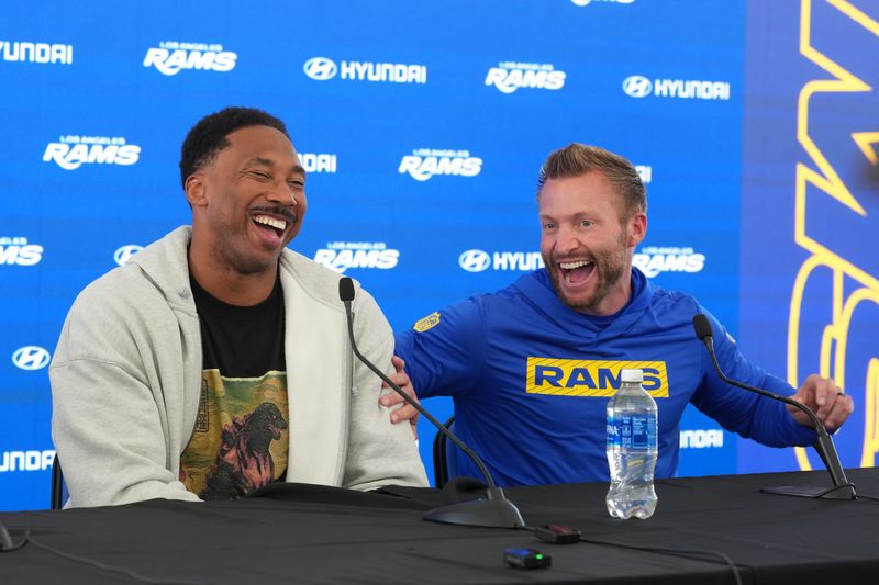 Jun 2, 2026; Woodland Hills, CA, USA; Los Angeles Rams defensive end Myles Garrett (left) and coach Sean McVay react at press conference at Rams Practice Facility. Mandatory Credit: Kirby Lee-Imagn Images