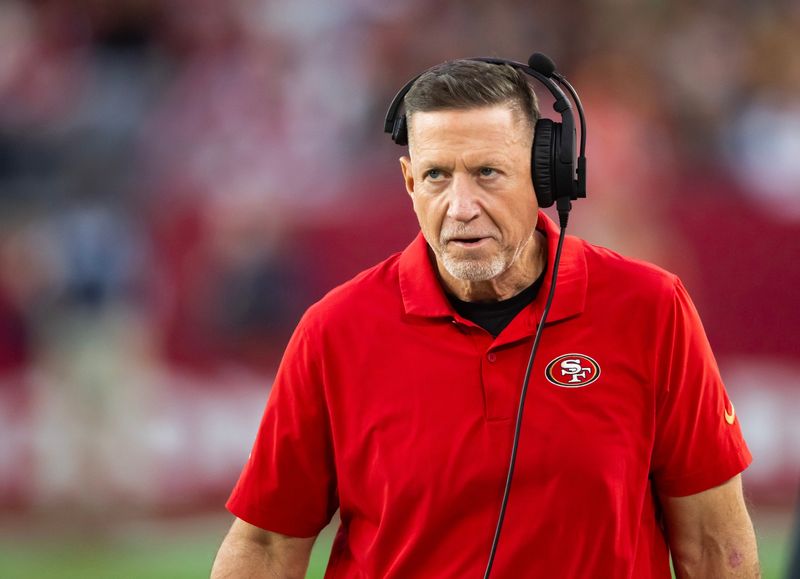 Jan 5, 2025; Glendale, Arizona, USA; San Francisco 49ers offensive line coach Chris Foerster against the Arizona Cardinals at State Farm Stadium. Mandatory Credit: Mark J. Rebilas-Imagn Images