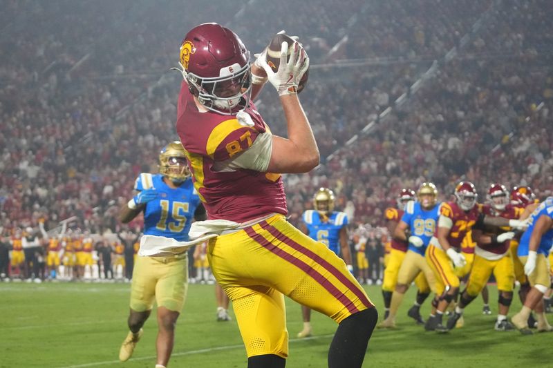 Nov 29, 2025; Los Angeles, California, USA; Southern California Trojans tight end Lake McRee (87) catches a 2-yard touchdown pass against the UCLA Bruins in the second half at United Airlines Field at Los Angeles Memorial Coliseum. Mandatory Credit: Kirby Lee-Imagn Images