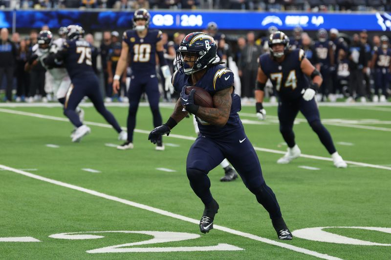 Dec 27, 2025; Inglewood, California, USA; Los Angeles Chargers running back Omarion Hampton (8) runs after the catch against the Houston Texans during the second half at SoFi Stadium. Mandatory Credit: Kiyoshi Mio-Imagn Images