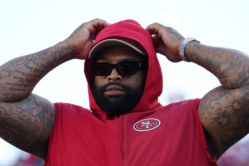 Aug 9, 2025; Santa Clara, California, USA; San Francisco 49ers offensive lineman Trent Williams (71) watches from the sideline in the first quarter against the Denver Broncos at Levi's Stadium. Mandatory Credit: David Gonzales-Imagn Images