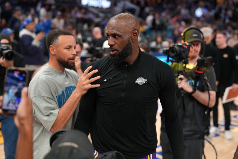 Apr 9, 2026; San Francisco, California, USA; Los Angeles Lakers forward LeBron James (23) meets with Golden State Warriors guard Stephen Curry (30) after the game at the Chase Center. Mandatory Credit: Cary Edmondson-Imagn Images