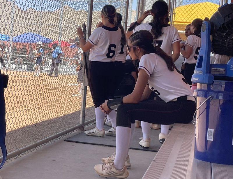Riverside Prep pitcher Lila Morris watches the action while sitting on the bench during the bottom of the fifth inning against Redwood on Thursday, June 4, 2026.