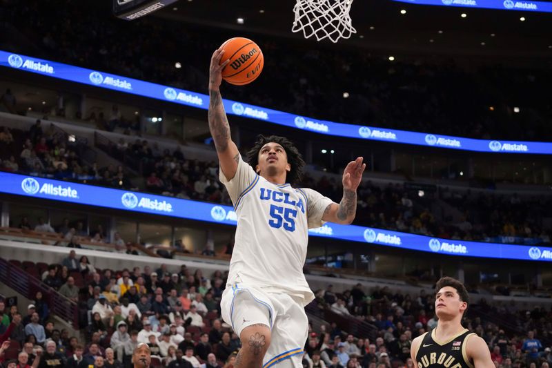Mar 14, 2026; Chicago, IL, USA; UCLA Bruins guard Skyy Clark (55) goes to the basket on Purdue Boilermakers guard Omer Mayer (17) during the second half at United Center. Mandatory Credit: David Banks-Imagn Images