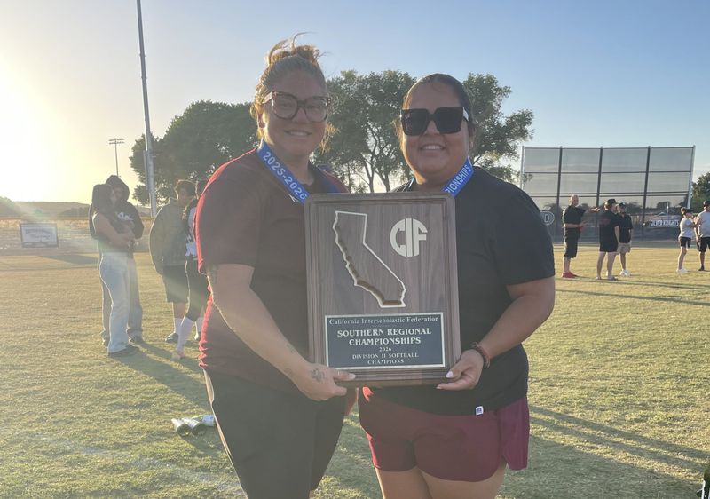 Riverside Prep coaches Lou Allan, left, and Ivet Rodriguez pose for a photo with the CIF Southern Regional Division II championship plaque on Saturday, June 6, 2026.