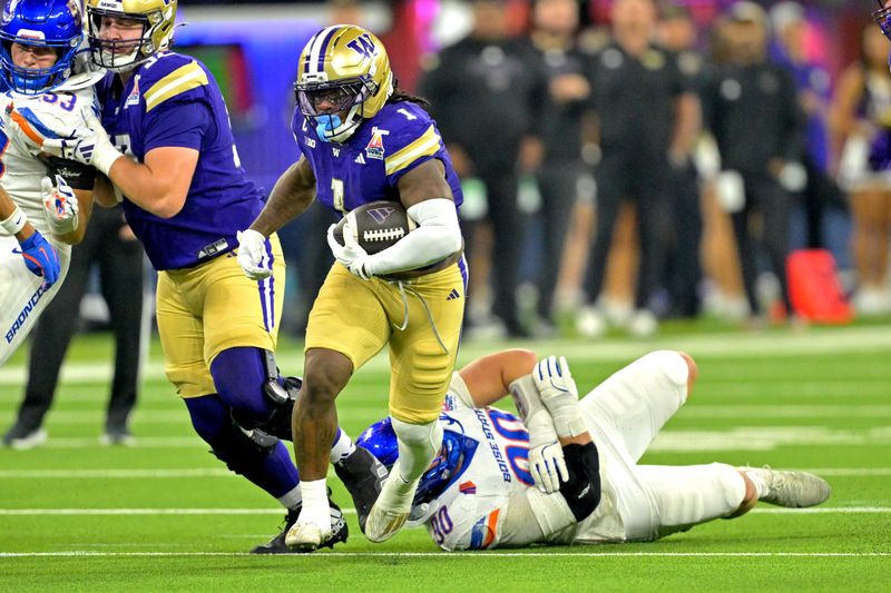Dec 13, 2025; Inglewood, CA, USA; Washington Huskies running back Jonah Coleman (1) carries past Boise State Broncos wide receiver Cameron Bates (80) for a first down in the first half of the LA Bowl at SoFi Stadium. Mandatory Credit: Jayne Kamin-Oncea-Imagn Images