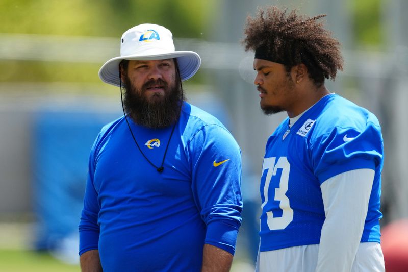 May 21, 2024, Thousand Oaks, California, USA; Los Angeles Rams offensive line coach Ryan Wendell (left) and lineman Steve Avila (73) during organized team activities at Cal Lutheran University. Mandatory Credit: Kirby Lee-USA TODAY Sports