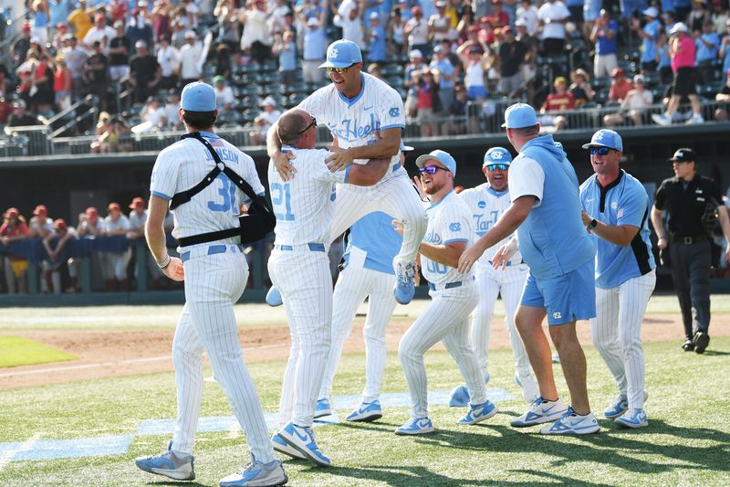 June 7, 2026; Chapel Hill, NC, USA; North Carolina Tar Heels head coach Scott Forbes celebrates a win with the coaching staff against the USC Trojans at Boshamer Stadium. Mandatory Credit: Zachary Taft-Imagn Images
