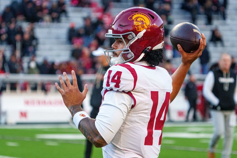 Nov 1, 2025; Lincoln, Nebraska, USA; Southern California Trojans quarterback Jayden Maiava (14) warms up before the game against the Nebraska Cornhuskers at Memorial Stadium. Mandatory Credit: Dylan Widger-Imagn Images