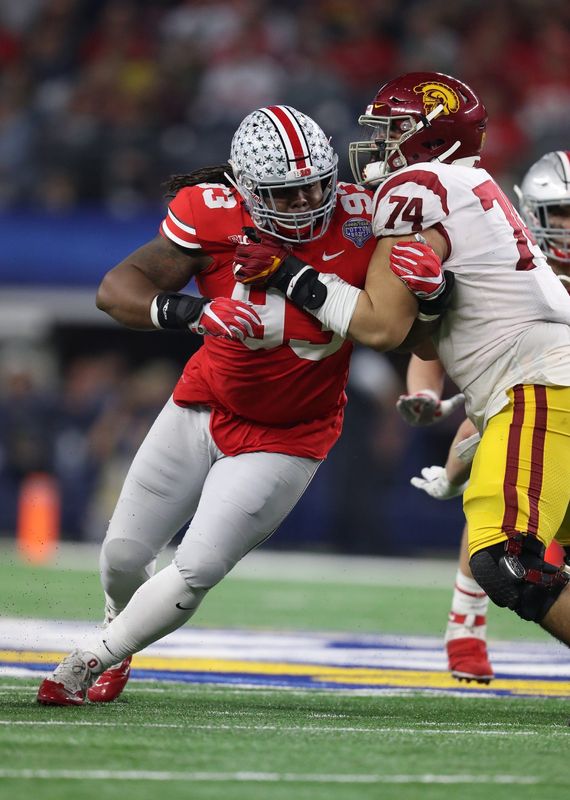Dec 29, 2017; Arlington, TX, USA; Ohio State Buckeyes defensive tackle Tracy Sprinkle (93) rushes the passer against Southern California Trojans center Nico Falah (74) in the 2017 Cotton Bowl at AT&T Stadium. Mandatory Credit: Matthew Emmons-USA TODAY Sports