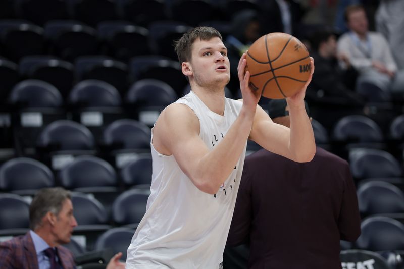 Feb 12, 2025; Salt Lake City, Utah, USA; Utah Jazz center Walker Kessler (24) warms up before a game against the Los Angeles Lakers at Delta Center. Mandatory Credit: Chris Nicoll-Imagn Images