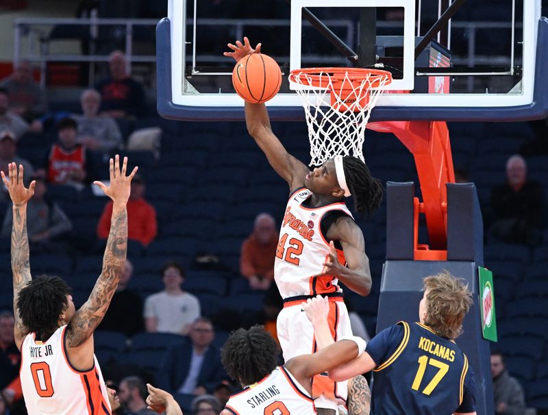 Feb 11, 2026; Syracuse, New York, USA; Syracuse Orange forward William Kyle III (42) blocks a shot by the California Golden Bears in the second half at the JMA Wireless Dome. Mandatory Credit: Mark Konezny-Imagn Images