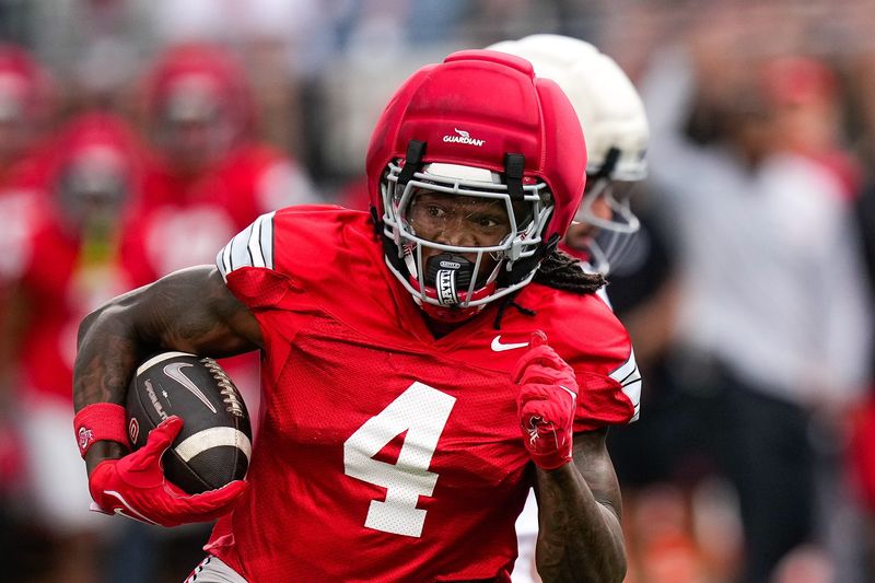 Wide receiver Jeremiah Smith (4) runs the ball during the Ohio State football spring game at Ohio Stadium on Saturday, April 18, 2026 in Columbus, Ohio.