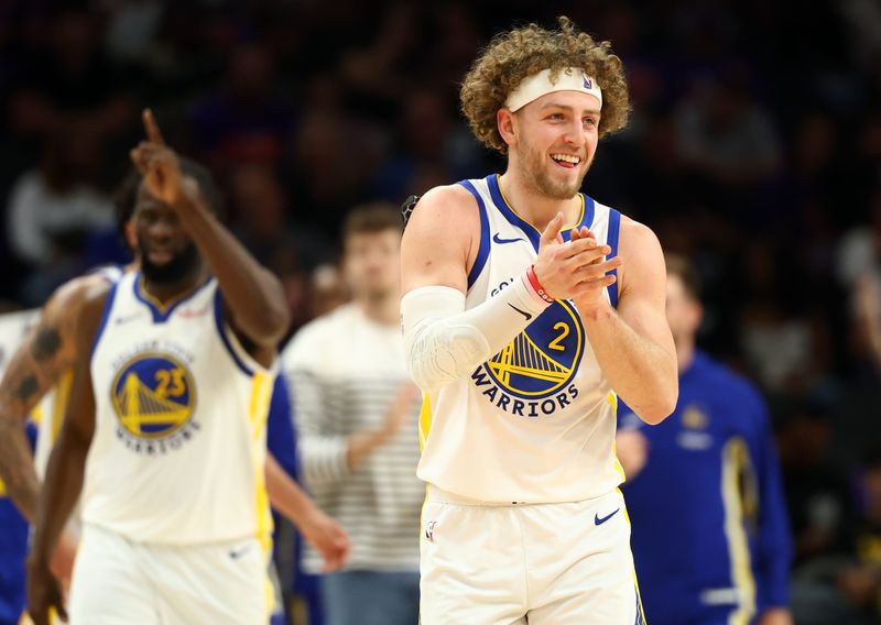 Apr 17, 2026; Phoenix, Arizona, USA; Golden State Warriors guard Brandin Podziemski (2) celebrates against the Phoenix Suns during the first half in the play-in rounds of the 2026 NBA Playoffs at Mortgage Matchup Center. Mandatory Credit: Mark J. Rebilas-Imagn Images