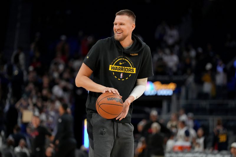 Apr 5, 2026; San Francisco, California, USA; Golden State Warriors forward Kristaps Porzingis (7) stands on the court before the start of the game against the Houston Rockets at the Chase Center. Mandatory Credit: Cary Edmondson-Imagn Images
