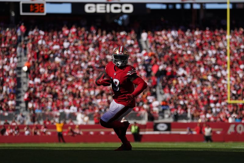 Oct 23, 2022; Santa Clara, California, USA; San Francisco 49ers wide receiver Deebo Samuel (19) runs with the ball after making a catch against the Kansas City Chiefs in the second quarter at Levi's Stadium. Mandatory Credit: Cary Edmondson-USA TODAY Sports
