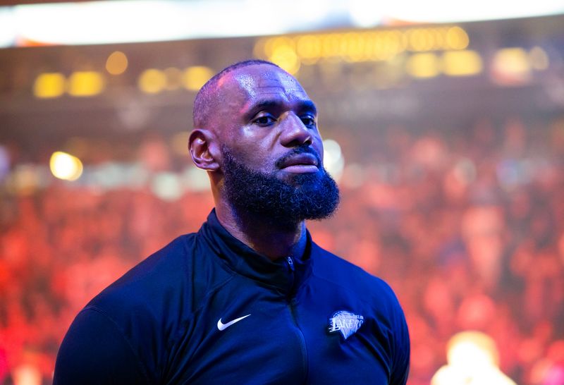 Dec 23, 2025; Phoenix, Arizona, USA; Los Angeles Lakers forward LeBron James (23) against the Phoenix Suns at Mortgage Matchup Center. Mandatory Credit: Mark J. Rebilas-Imagn Images