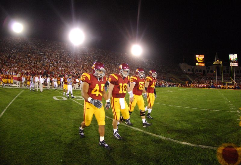 Nov 11, 2006; Los Angeles, CA, USA; Southern California team captains Oscar Lua (45), John David Booty (10), Ryan Kalil (67) and Dallas Sartz (42) walk onto the field for coin toss before the game against Oregon at the Los Angeles Memorial Coliseum. Mandatory Credit: Kirby Lee-USA TODAY Sports