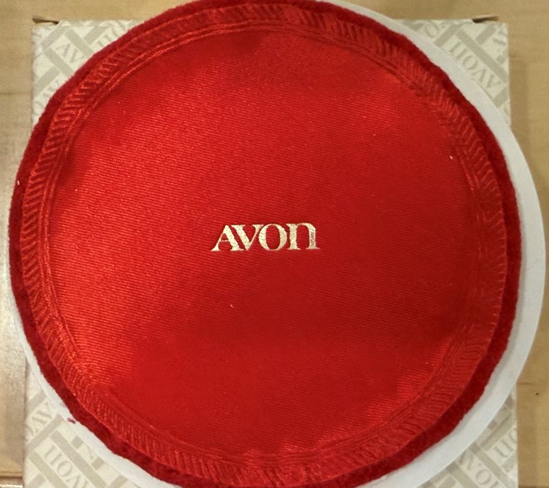 Avon powder puffs like this one delivered the promise of glamour to millions of women.