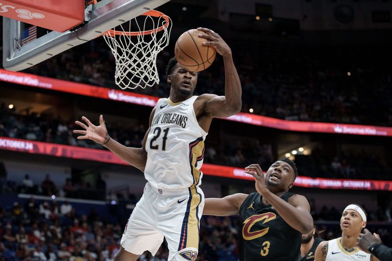 Mar 21, 2026; New Orleans, Louisiana, USA;  New Orleans Pelicans center Yves Missi (21) grabs a rebound against Cleveland Cavaliers center Thomas Bryant (3) during the first half at Smoothie King Center. Mandatory Credit: Matthew Hinton-Imagn Images