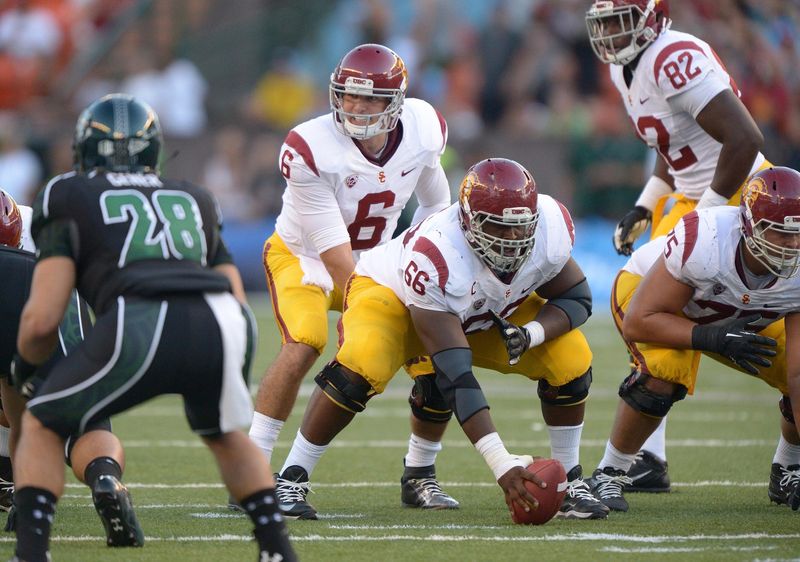 Aug 29, 2013; Honolulu, HI, USA; Southern California Trojans quarterback Cody Kessler (6) takes the snap from center Marcus Martin (66) against the Hawaii Rainbow Warriors at Aloha Stadium. Mandatory Credit: Kirby Lee-USA TODAY Sports